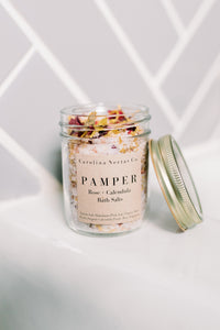 Herbal bath salts for pampering with rose petals and calendula